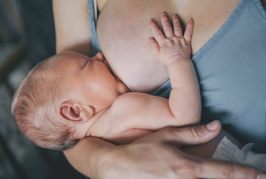 Mother breastfeeding her newborn.