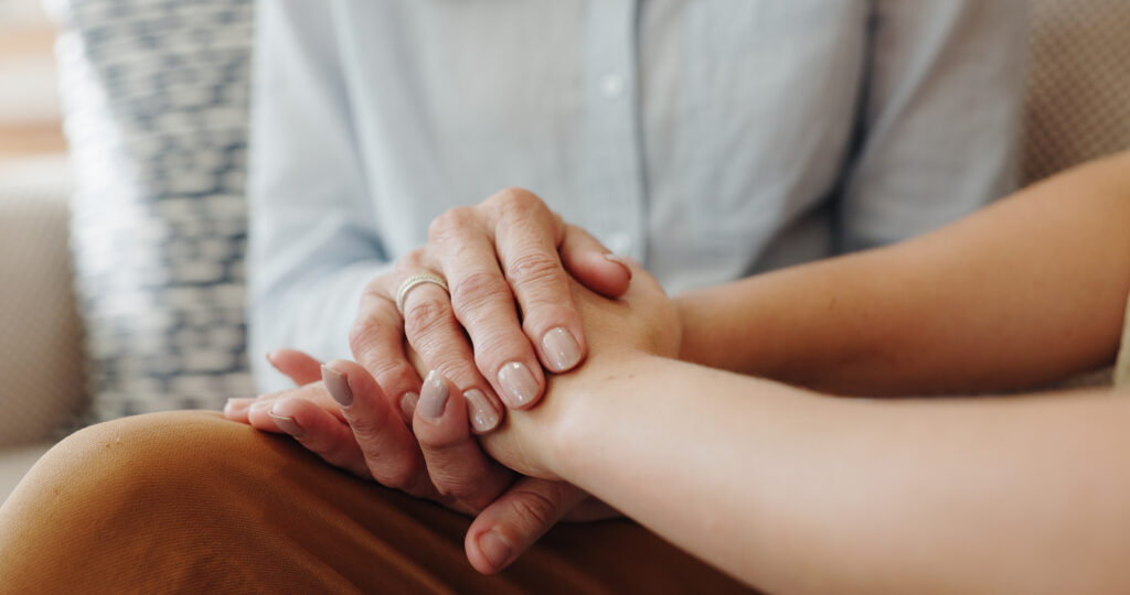 Holding hands, senior woman and child with support, comfort and sympathy with compassion. Retirement, closeup and pensioner with kid, family friend and empathy with trust, kindness or grief with loss.